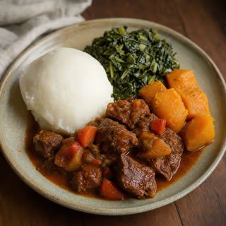 Beef stew with sadza, covo and pumpkin